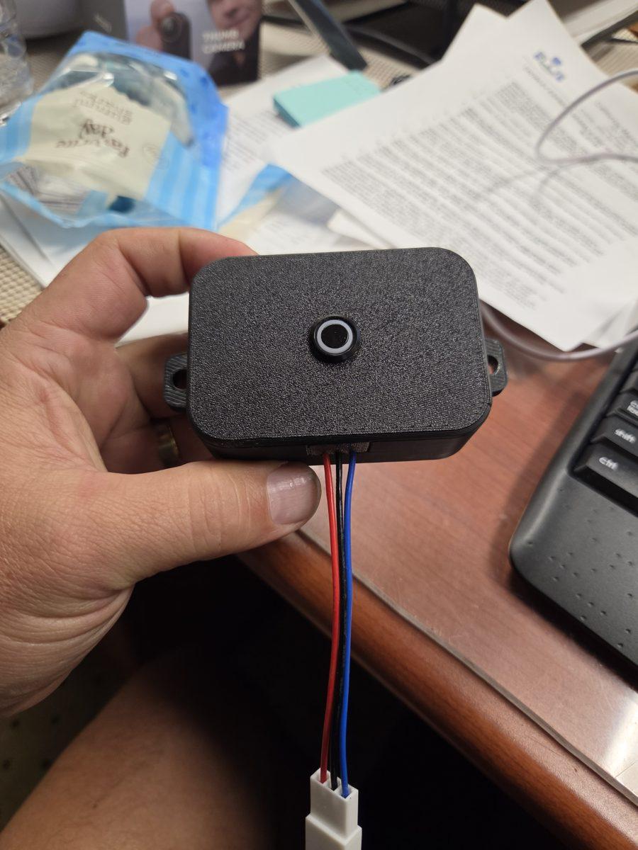 Steamer Power Guardian in hand, wires and plug below the box